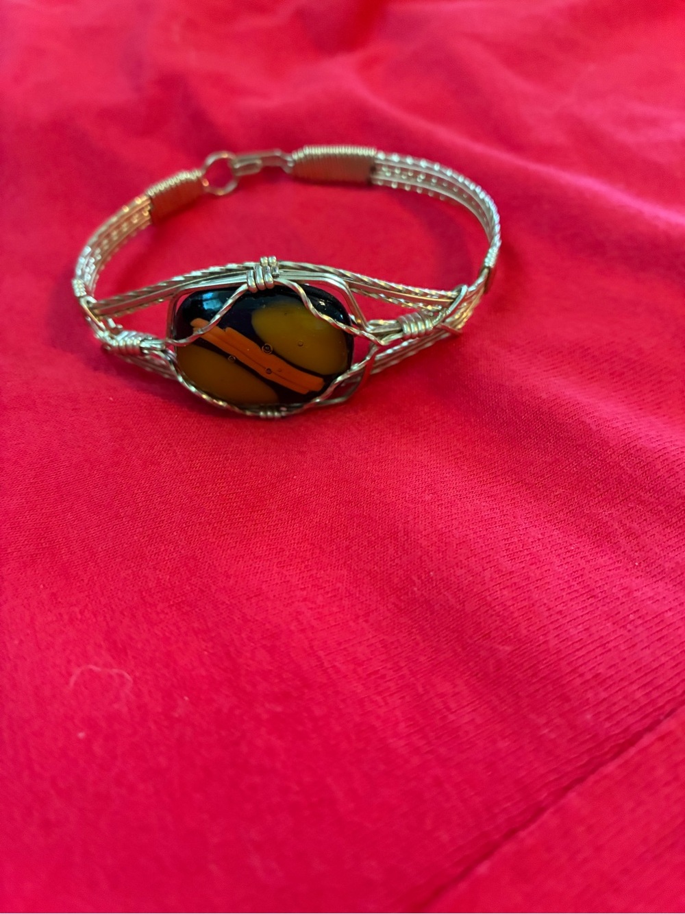 Handmade gold
Wire Wrapped Bracelet with Black and Yellow Glass Cabochon